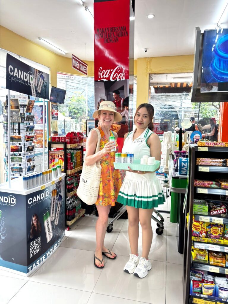 SPG melakukan sampling produk Candid di in-store activation Bali