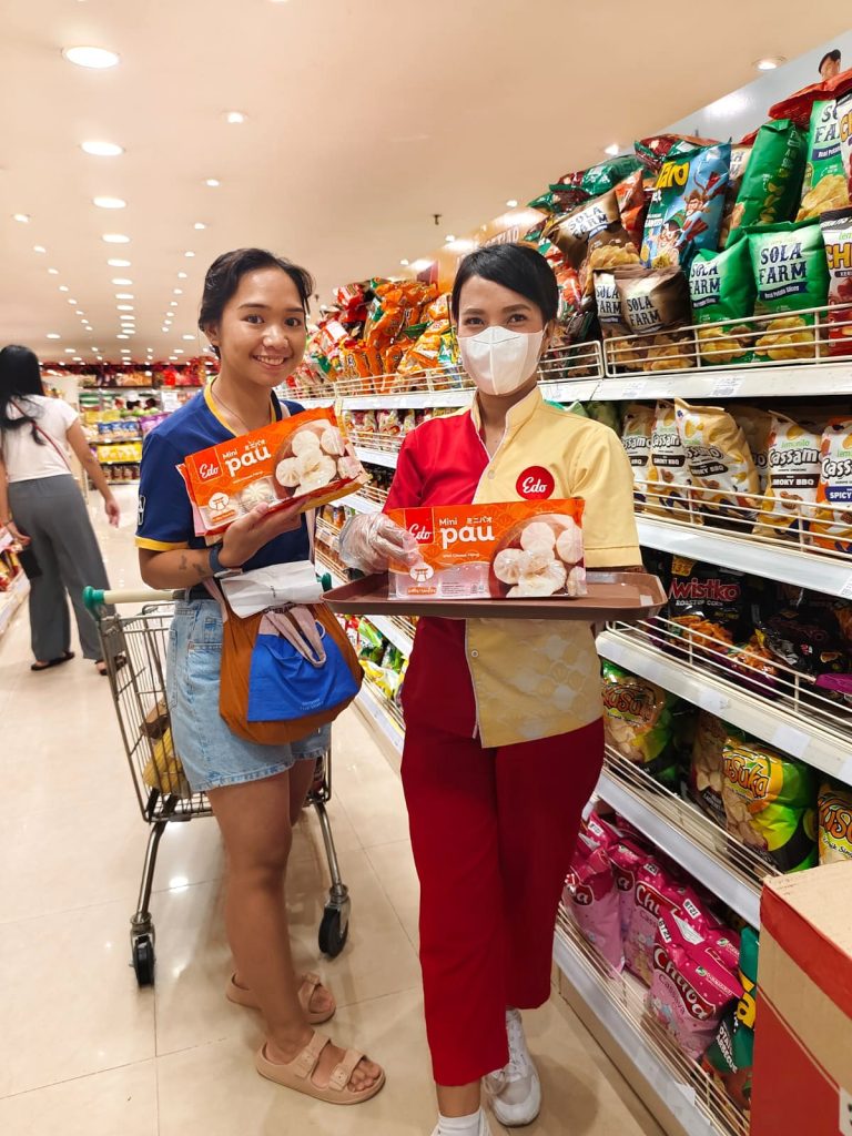 SPG in-store activation team interacting directly with shoppers in modern trade